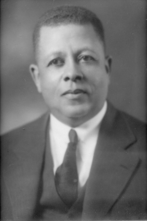 Photo Description: Harvard attorney Hugh Macbeth. This shot looks like a portrait shot where he is seated, wearing a suit and tie.